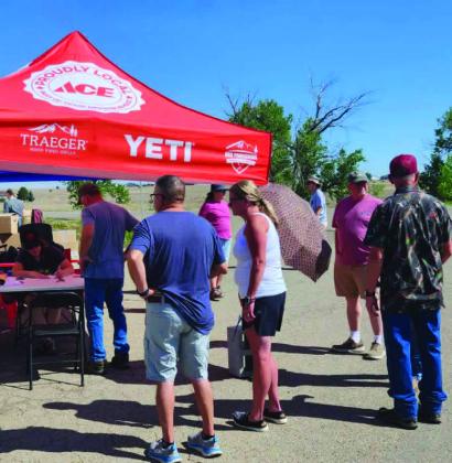Returning Colorado City residents line up for assistance at the Church of Christ registration tent. Photo by Shirley Pigg