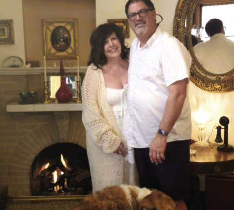 Cindy and Jeff Bailey, along with the official Abriendo Inn greeter, Bentley, pose in the lobby of the Abriendo Inn during the winter of 2026 Photo by Shirley Pigg