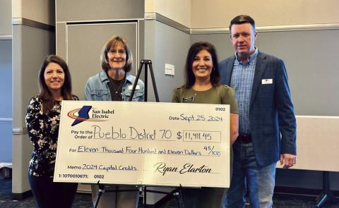 SIEA celebrates 2024 captial credits, (L-R) D70 CFO Amanda Wittman, SIEA Dist. 8 Board Member Doris Morgan, D70 Public Information Officer Lynette Bonfiglio, and San Isabel Electric General Manager Ryan Elarton. Courtesy Photo