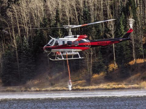 On Sunday helicoptors were seen lifting water from Lake Isabel to fight the blaze northwest of Colorado City and Rye. Photo courtesy of Deb Straub