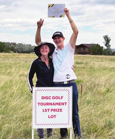 Cristian Jojola and his number one fan look over the Colorado City property that he won in the first Darren Butcher Memorial Disc Golf Tournament. Courtesy Photo