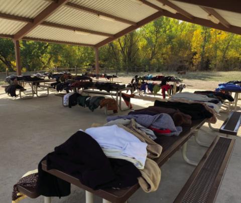 Jeremy Walker displays donated coats at the Pavilion in Green-With horn Meadows Park the Sunday following the Lions Car Show. Courtesy Photo