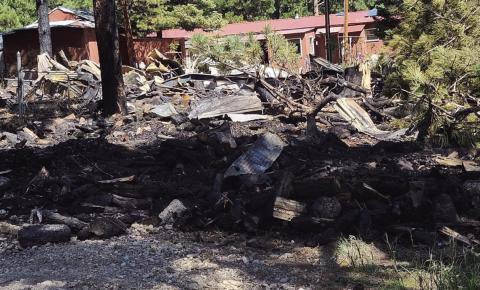 Although the home was a total loss, the structure fire on Maple Drive was quickly contained to one lot. Photo by Shirley Pigg