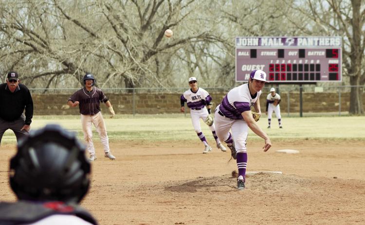 Joe Valdez fires a strike in a ball game against John Mall. Photo by Karen Rochester