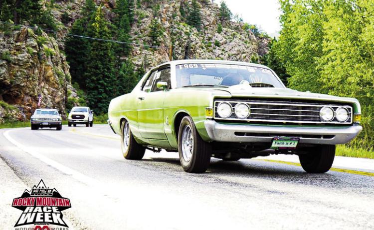Rocky Mountain Race Week Chaplain and drag racer Randy Peterson and daughter Jessica driving through Estes park in the 2022 event. Courtesy Photo