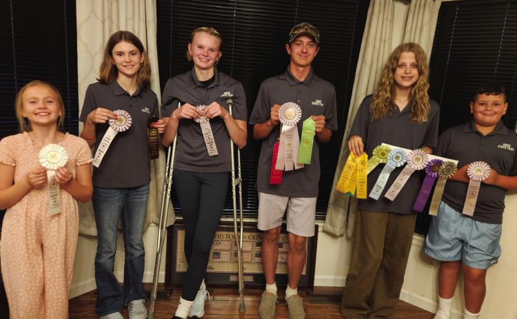 Greenhorn Kicker rifle shooters with their second-place team and other ribbons: L-R: Lucy Chandler, Lena Chandler, Molly Chandler, Zack Mansfield, Estella Pearson, Tommy Hart. Not pictured: Clara Chandler, Kimmie Power, Bryer Power.
