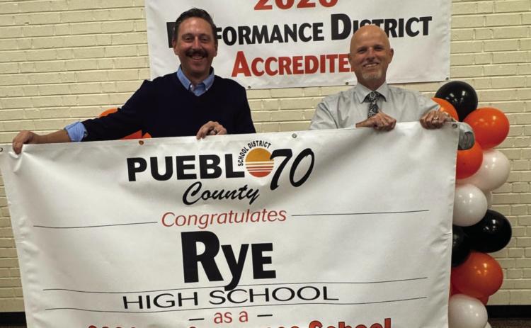 RHS Principal Matt DeJong and Pueblo County School District 70 Interim Superintendent Bob DePietro display 2026 Accreditation Banner . Courtesy Photo