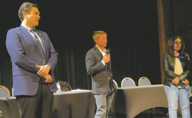 Pueblo County Commissioners (L-R) Miles Lucero, Zach Swearingen, Paula McPheeters give their attention to people attending a forum at the Sangre de Cristo Arts Center.