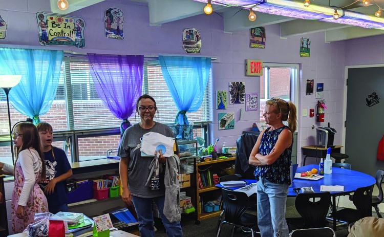 Third grade teacher Lindsay Jarbo (right) visits with parents and students at the Rye Elementary open house last Thursday evening Photo by Terry Kraus