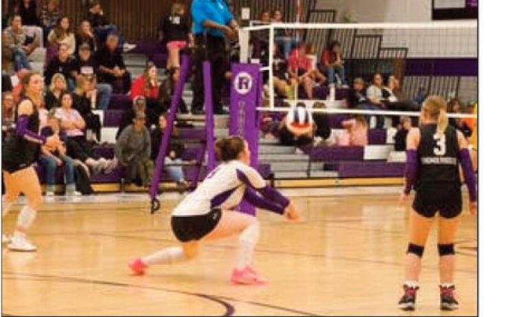 Seine Roy passing, to her left is Taylor Pye and to her right is Trinity Felthager