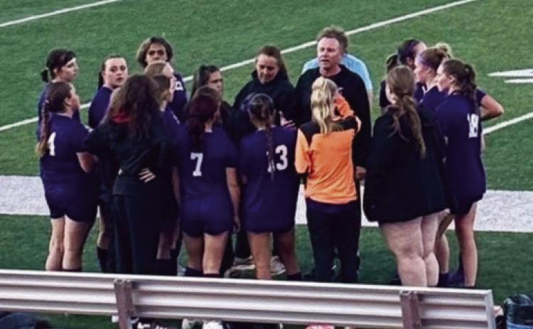 With a 3- 2 lead at half - time, Coach John Crowell gathers his team for second half instructions. Last year Fountain Valley beat the Thunderbolts 5- 0 Photo by Jack Graham