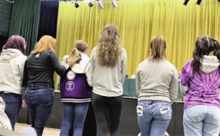 RHS students and the girls volleyball team address the D70 school board in support of Coach Donlon. Courtesy Photo