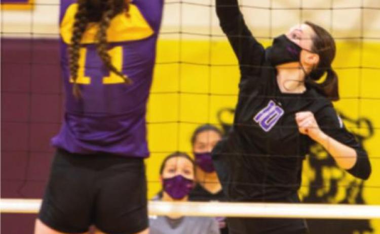Photo by Sue Barcus Abbi Sammons #10 sliding her hit past Fowler’s defense.