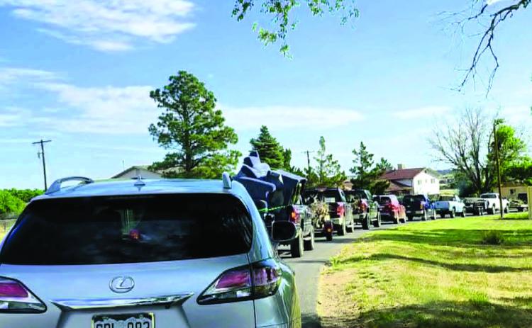 Well before the start time of 8:00 a.m., the line for the Community Cleanup Day stretched from the Colorado City Recreation Center all the way up Cuerno Verde to Lake Beckwith. Photo by Shirley Pigg