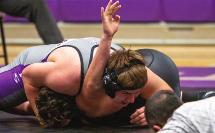 Devin Samuelson wrestling at 220 on Friday night, Dec. 17, during a dual meet with John Mall and Mancos H.S. pinned his opponent from John Mall. Photo by Sue Barcus