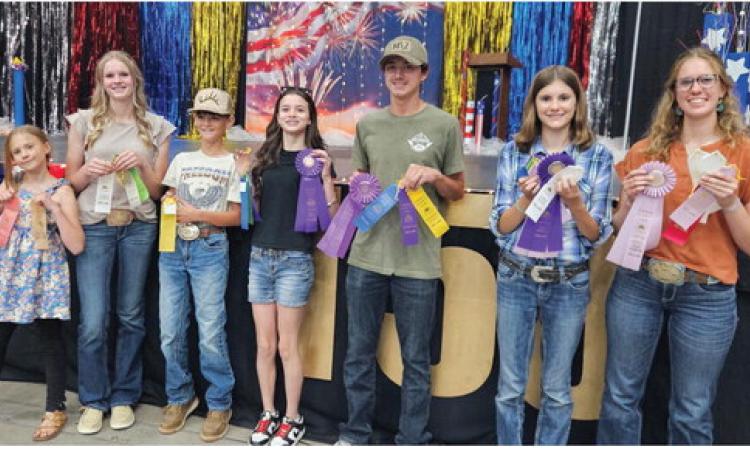 Greenhorn Kickers with their County Fair ribbons. L-R: Lucy Chandler, Molly Chandler, Bryer Power, Kimmie Power, Zack Mansfield, Lena Chandler and Clara Chandler. Not Pictured: Tommy Hart Courtesy Photo
