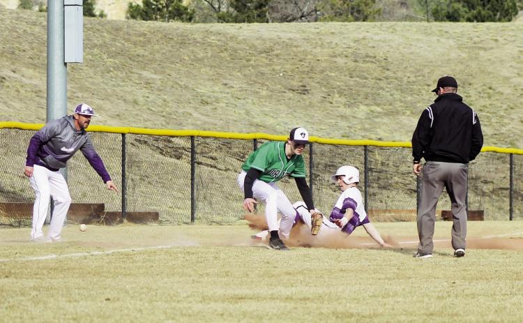 RHS Baseball playerJoe Valdez, as Coach Graham tells him to 'Get Dirty' ,coming into 3rd at the March 14, St. Mary’s High School contest. Photo by Karen Rochester
