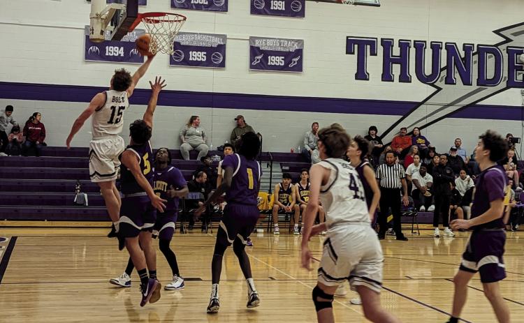 Rye High School’s Codah Graber (#15) has a nice reverse layup during the Boys varsity BB game against Ellicott on Friday night on the hometeam court. Photo by Deb Straub