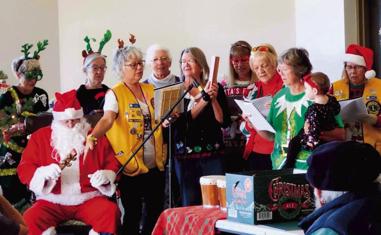 VFC Volunteers, Lions Club members, and Santa Claus all joined voices to create a great and happy sing-along. Photo by Shirley Pigg