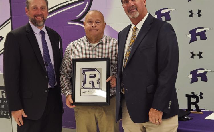 Matt DeJong (L), Principal of Rye High School, and Jeff Bailey (R), long time RHS Football Coach, present a Hall of Fame plaque to Frank Whalen. Courtesy Photo
