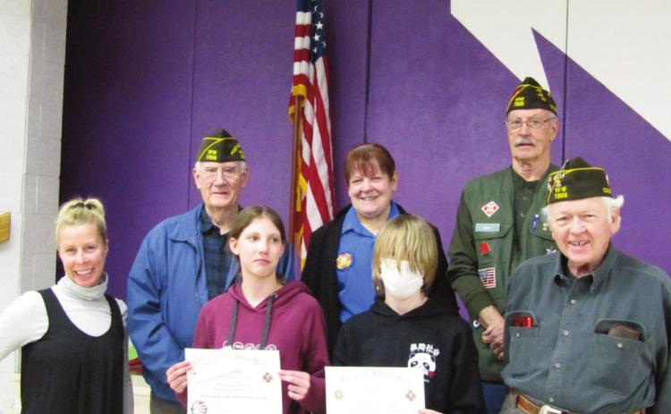The Craver Middle School Patriot’s Pen Ceremony honors award winners and local veterans of foreign wars. L-R, teacher, Erin Sonnleitner; Veteran Tom Howard, student Miriam Peterson, Auxilliary President Toni Liebnow, stu dent Shiloh Rutledge, Veteran Jerry Collins, and Veteran Jimmie Porter. Photo by Shirley Pigg
