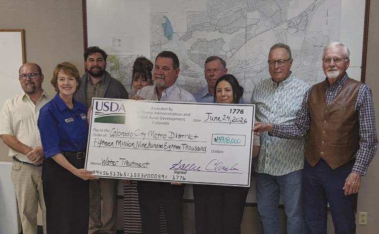 Members of the USDA and Colorado Rural Water join CCMD Board Members to receive a combination grant and loan for a pretreatment water facility in the amount of $16 million. Photo by Terry Kraus