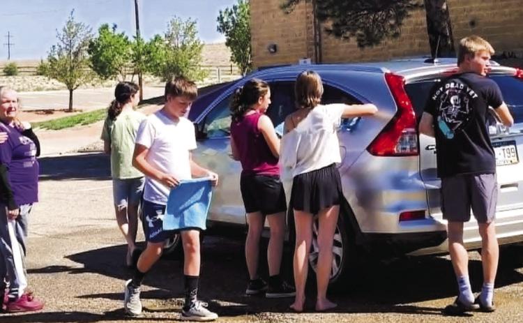 Students turned on the water and suds to help support the Thunderbolt Music Program on Saturday, May 16 at Craver Middle School. Photo by Shirley Pigg