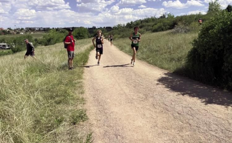 David Maroney (center) was the highest finisher for the Rye High School Boys Cross Country team at the Cheyenne Stampede. Courtesy Photo