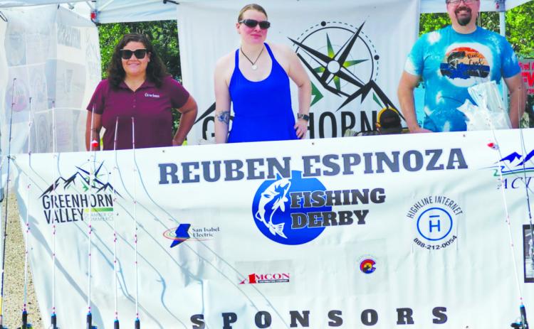 Greenhorn Valley Chamber of Commerce members gathered early Saturday morning to open the registration booth for the fishing derby. Pictured (L-R) are Lauren Azuremar, Katherine MacLeod,and Joshua MacLeod. Photo by Shirley Pigg