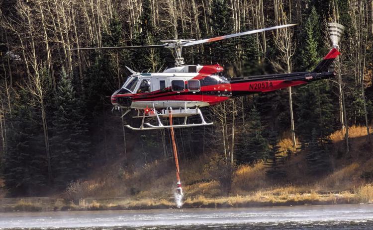 On Sunday helicoptors were seen lifting water from Lake Isabel to fight the blaze northwest of Colorado City and Rye. Photo courtesy of Deb Straub