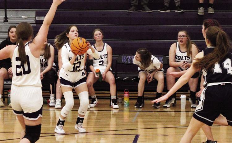 Morgan Gallegos, #12, scores a basket against Peyton. Photo by Karen Rochester
