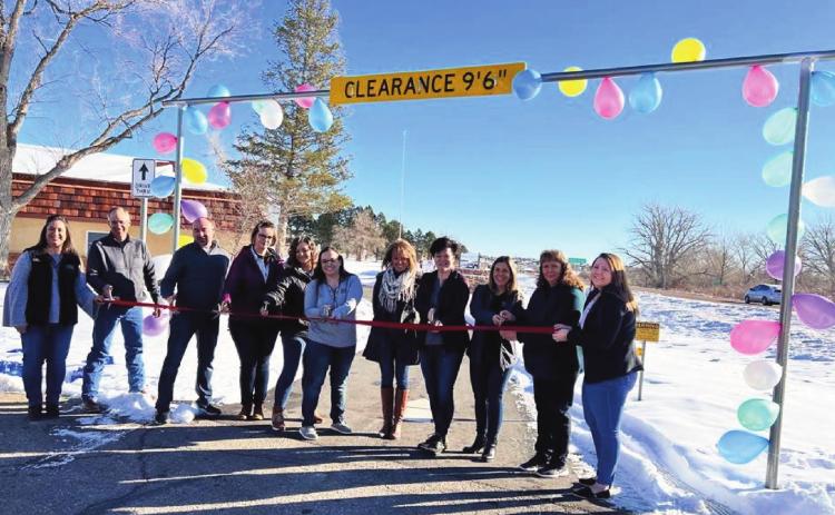 Celebration of a new drive-thru banking option at Bank of the San Juans was well attended at the Saturday morning ribbon-cutting. The Greenhorn Valley Chamber of Commerce, bank patrons, and bank personnel came out to commemorate the event: left to right are Aimee Keys, Willy Faris, Brian Prichard, Melissa Pye, Lacey Briggs, Kourtny Quillen, Terry Baughman, Karen Davis, Jackie Galli, Stacey Harner and Kelsi Baldwin. Courtesy Photo