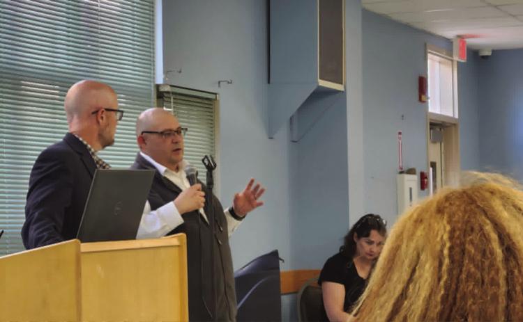 Jeffrey Dawson (L), Engineering Manager for Front Range Passenger Rail and Colorado Department of Transportation, and Luis Lopez, Front Range Passenger Rail Director, explain the proposed route and services of the train at a meeting at the Pueblo Photo by Shirley Pigg