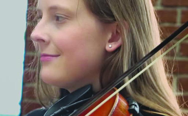 Charlotte Ryan, raised in the musical family of the Apache Creek Fiddlers, plays a variety of musical instruments. Courtesy Photo