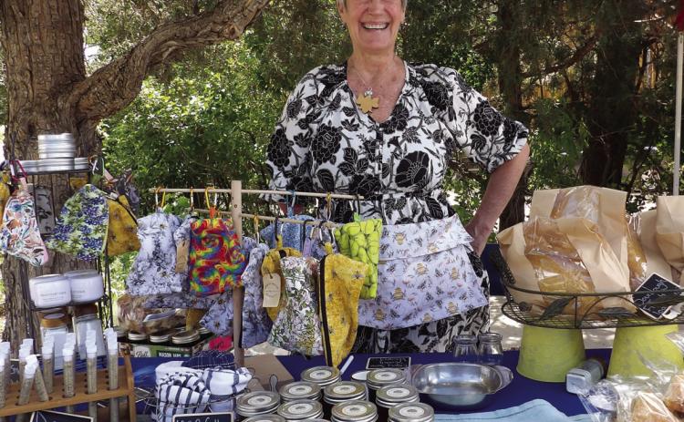 One of the Beulah Farmer’s Market vendors, Brook Courchaine, displays a variety of baked, canned and fabric items for sale. Courtesy Photo