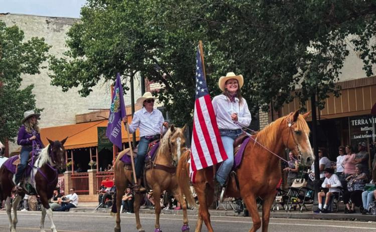 RCC Saddle Club proudly took to the streets of Pueblo to participate in the State Fair Parade. The American Flag is carried by Sydney Hecox Courtesy Photo