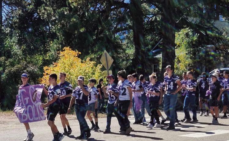Go Bolts! The RHS football team and coaches in the Homecoming parade. Photo by Shirley Pigg