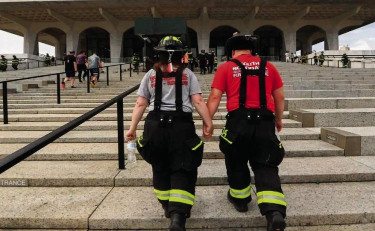 Kristine Probst, left, and Zachary Adams, an engaged couple from the South Schodack Fire District, join other firefighters, police and others in a benefit memorial stair climb on Sunday, Sept. 7, 2025, at the Empire State Plaza in Albany, N.Y., to remember first responders who died responding to the World Trade Center attacks on Sept. 11, 2001 Courtesy Photo