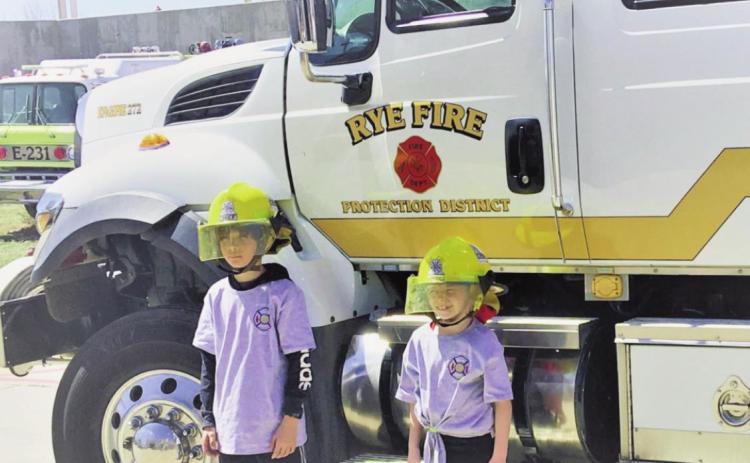 Third grade students Aynaleah Erskine and Nathan Slade honored with Fire Chief for the Day privileges at Rye Fire Protection District Photos by Shirley Pigg