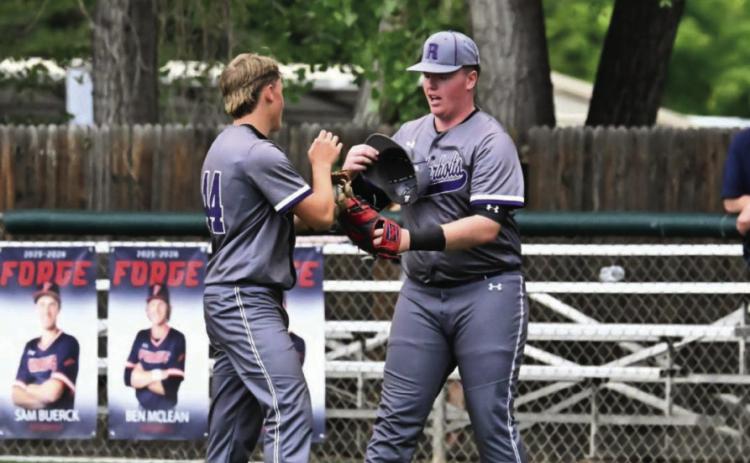 Branson Burbidge(44) and Grant Clennin(4) discuss strategy with runners on base Courtesy Photo