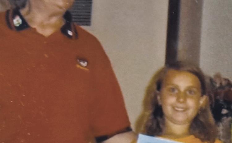 Seven-years-old Christie receiving an award for completing a first year in Awana with Sparks leader Barb Zorc. Courtesy Photo
