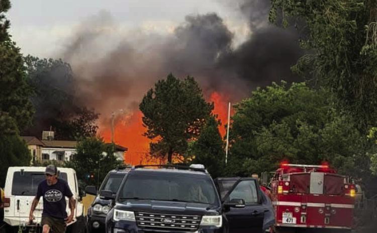 Sunday, June 21, brought evacuation orders to the Applewood Estates community in Colorado City due to a Highway I-25 fire that blew into the area. Firefighting efforts brought the fire under control quickly but several homes were destroyed by the blaze. Courtesy Photo