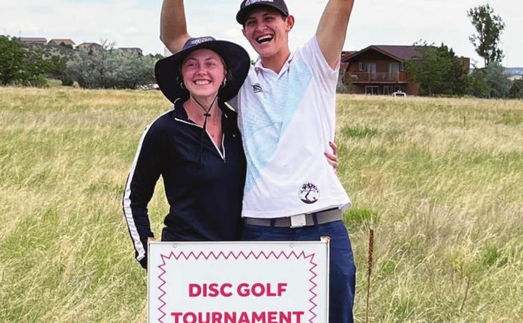 Cristian Jojola and his number one fan look over the Colorado City property that he won in the first Darren Butcher Memorial Disc Golf Tournament. Courtesy Photo