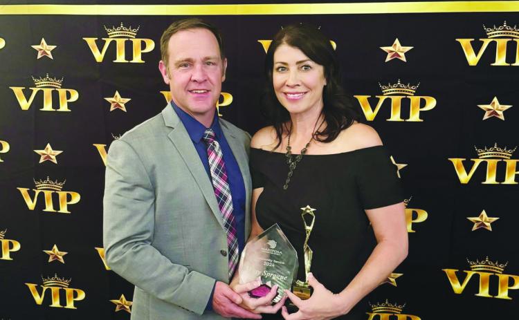 Misty Sprague, with husband Josh, receives the Community Service Award for her work as Executive Director of Colorado City’s Valley First. Courtesy Photo