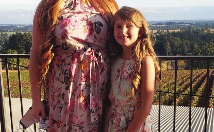 New Rye Town Clerk Jocelyn Mower, pictured with daughter Olivia, strives to fill the shoes of previous clerk Sherri Beach. Courtesy Photo