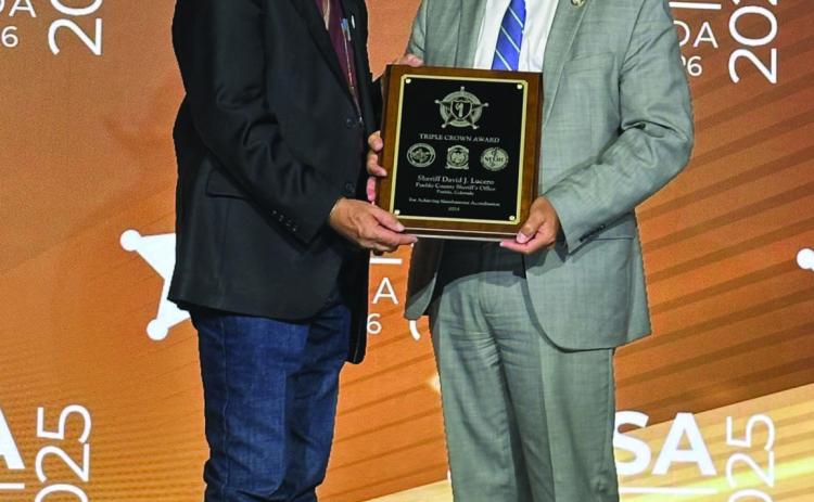 Sheriff Lucero (R) receiving the agency’s recent Triple Crown accreditation from National Sheriff’s Association President Kieran Donahue Courtesy Photo