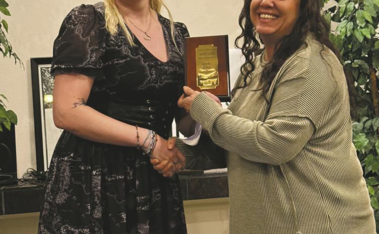 Branch Manager Kourtny Quillen accepts the Business of the Year Award for Bank of the San Juans at the Greenhorn Valley Chamber dinner on Saturday.