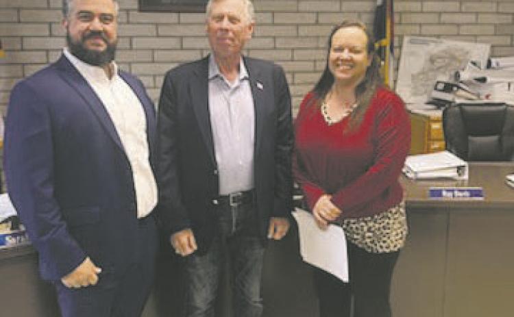 Courtesy Photo New members of the Colorado City Metro District were sworn in on May 7th. Pictured left to right are new board member Abdel Ayoub, new board member Bob Sievert, and Kourtney Quillen, Bank of the San Juans manager, who performed the swearing in. Both board members were appointed to a four-year term