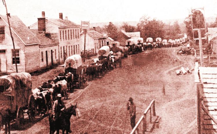 I Paola Miami Kansas. Wagon trains were often compiled of wagons driven by the women and carrying the children, with the men riding on horseback to scout ahead. Courtesy Photo