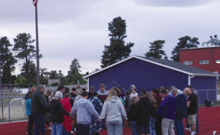 Fifty students, teachers and community members gathered around the flag pole at Rye High School to pray for the nation, Colorado, the community and the local schools. For more information read this week's Viewpoint . Courtesy Photo